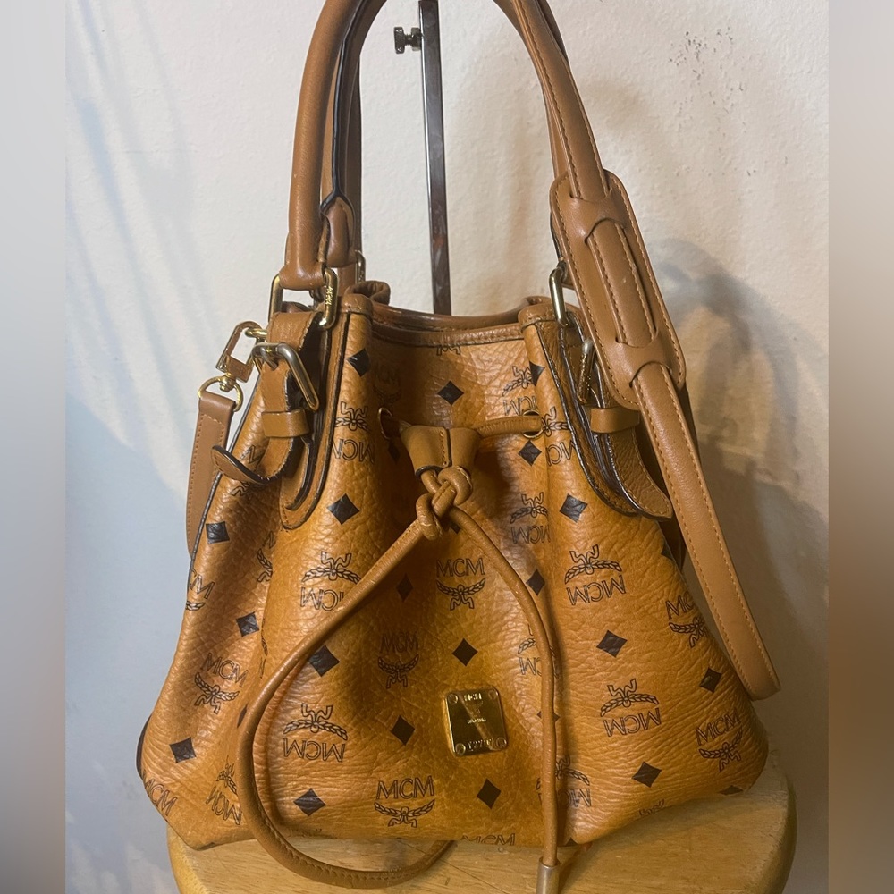 Super Sale!!MCM bag with Sling, a sign of usage. Clean inside no foul smell.